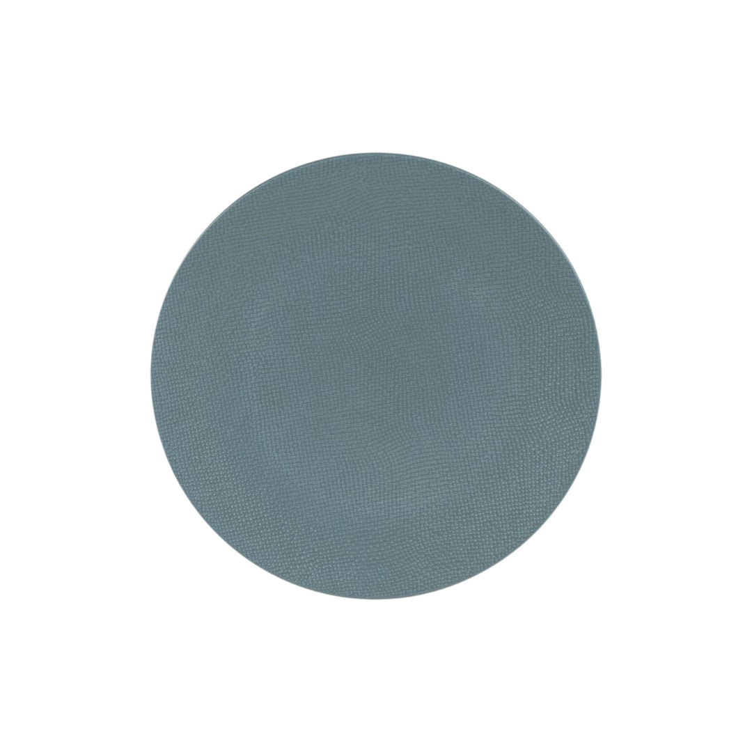 Top view of blue ceramic dessert plate with subtle textured surface.