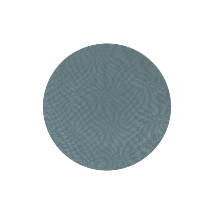Top view of blue ceramic dessert plate with subtle textured surface.