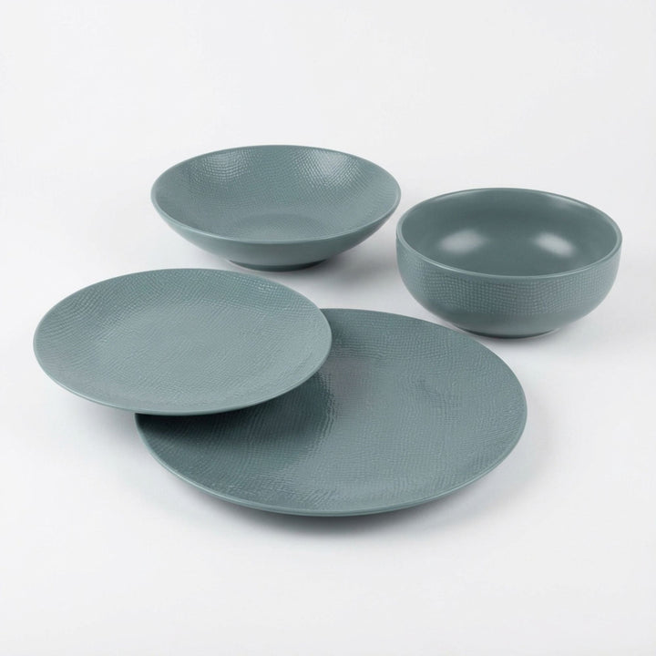 Blue Vesuvio ceramic tableware in soft blue-grey tones. Available in various sizes for elegant, Mediterranean-inspired dining.