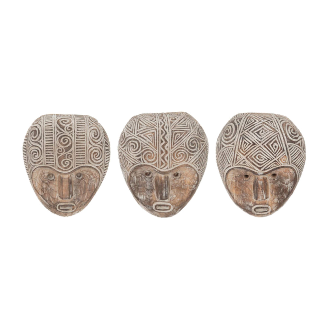 Front view of assorted Bobum Masks carved from natural albasia wood with white tribal patterns.