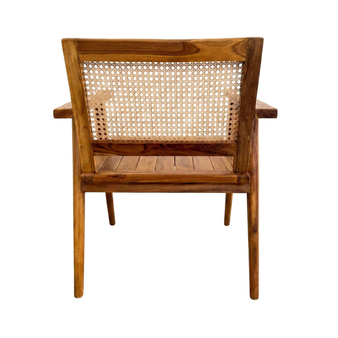 Rear view of the armchair showing the rattan backrest and teak wood frame.