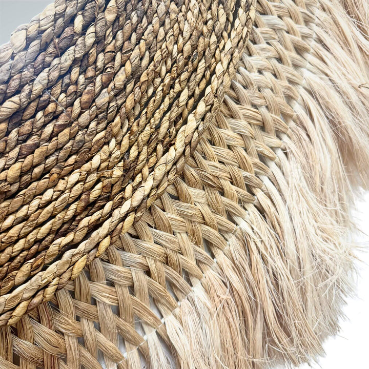 Close-up detail of banana fiber and sisal weaving highlighting the handcrafted texture.