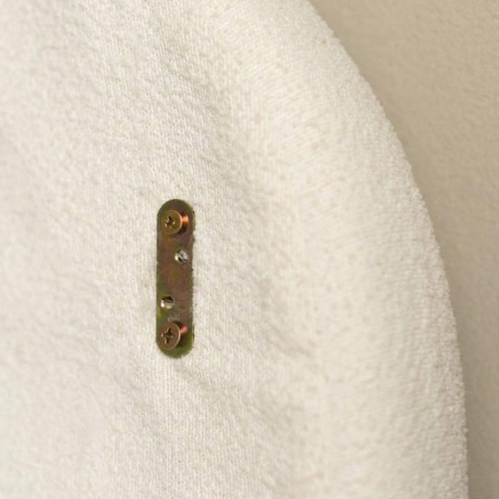 Rear view detail of the Bouclé Upholstered Headboard showing wall mounting hardware and upholstery finish.