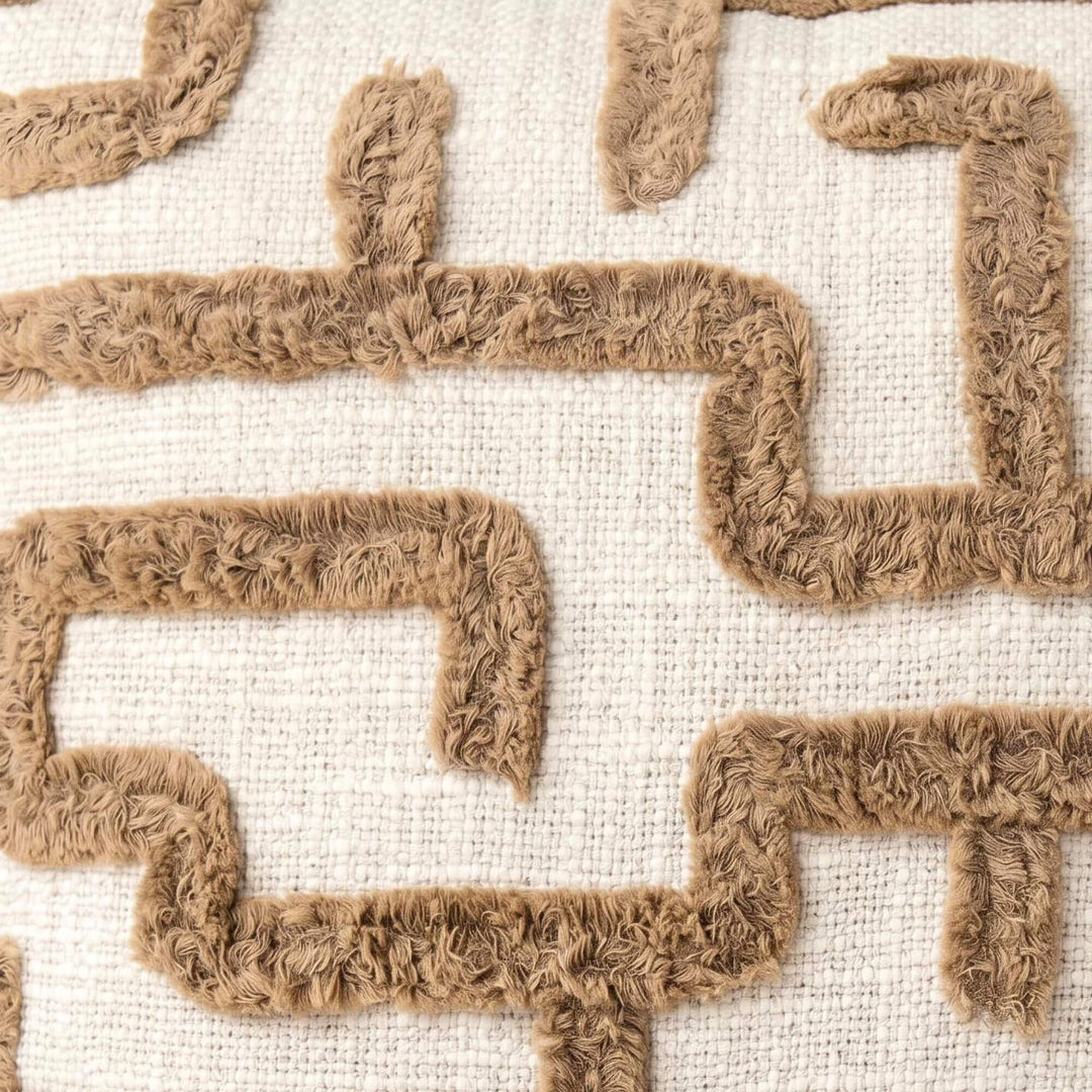 Close-up detail of the tufted geometric pattern on the woven fabric.