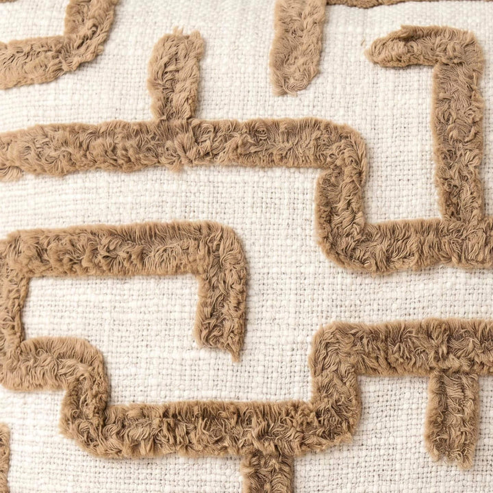 Close-up detail of the tufted geometric pattern on the woven fabric.