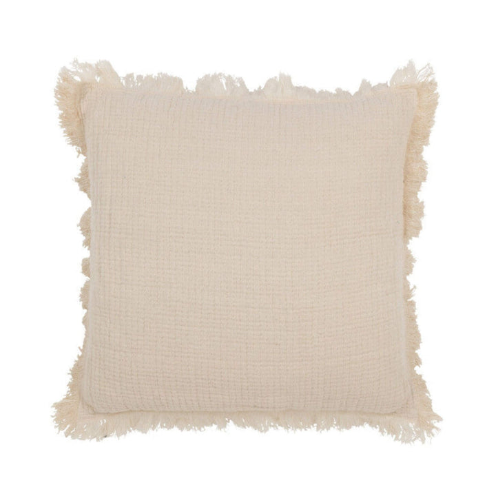 Brisa Cushion Cream front view showing textured cotton surface and fringed border.