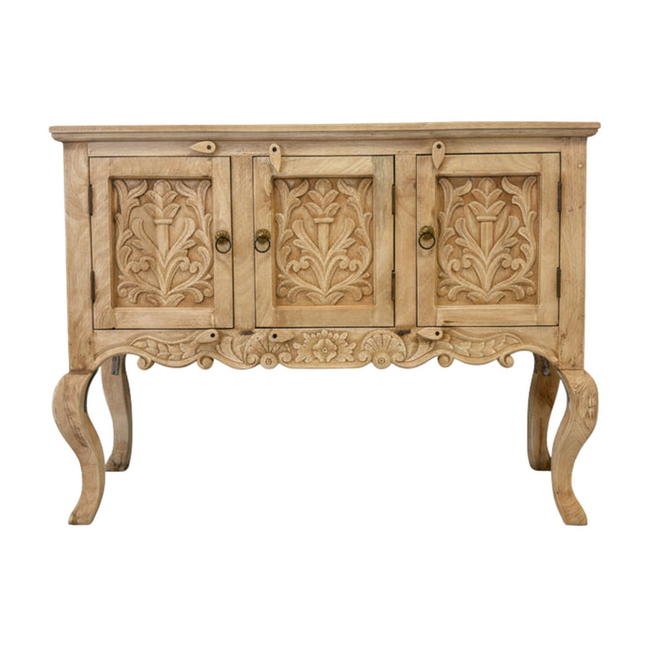 Front view of the Buffet White Briss Collection showing detailed floral carvings.