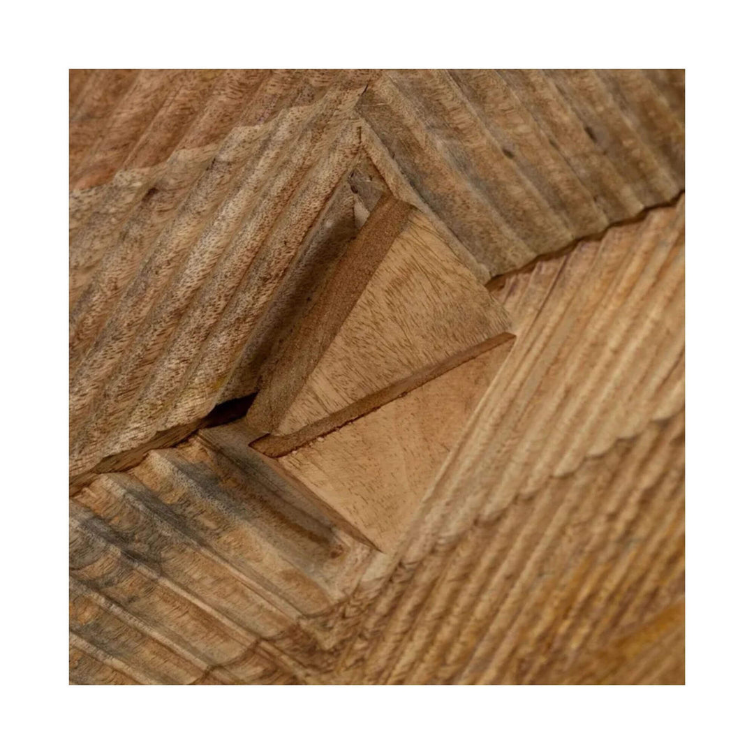 Close-up of geometric hand-carved detail on mango wood drawer front