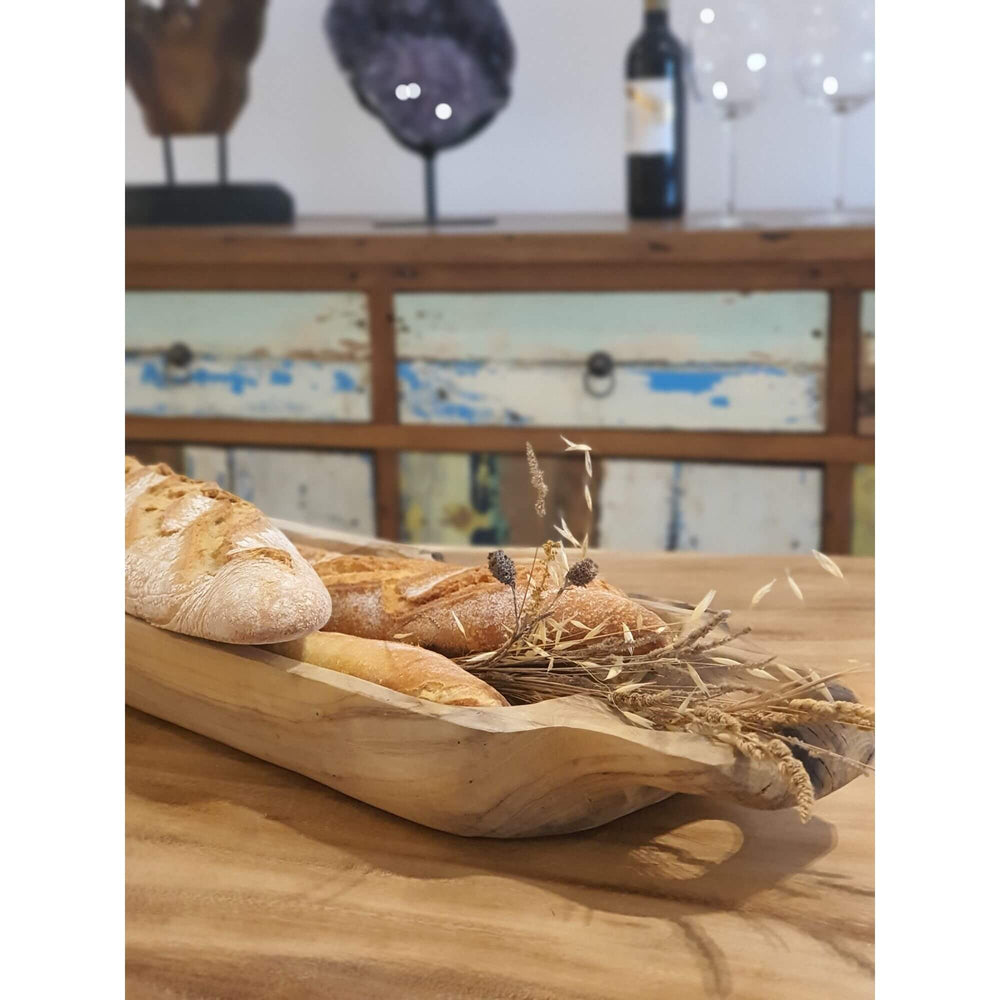 Buni teak tray styled on wooden table holding bread with natural rustic setting