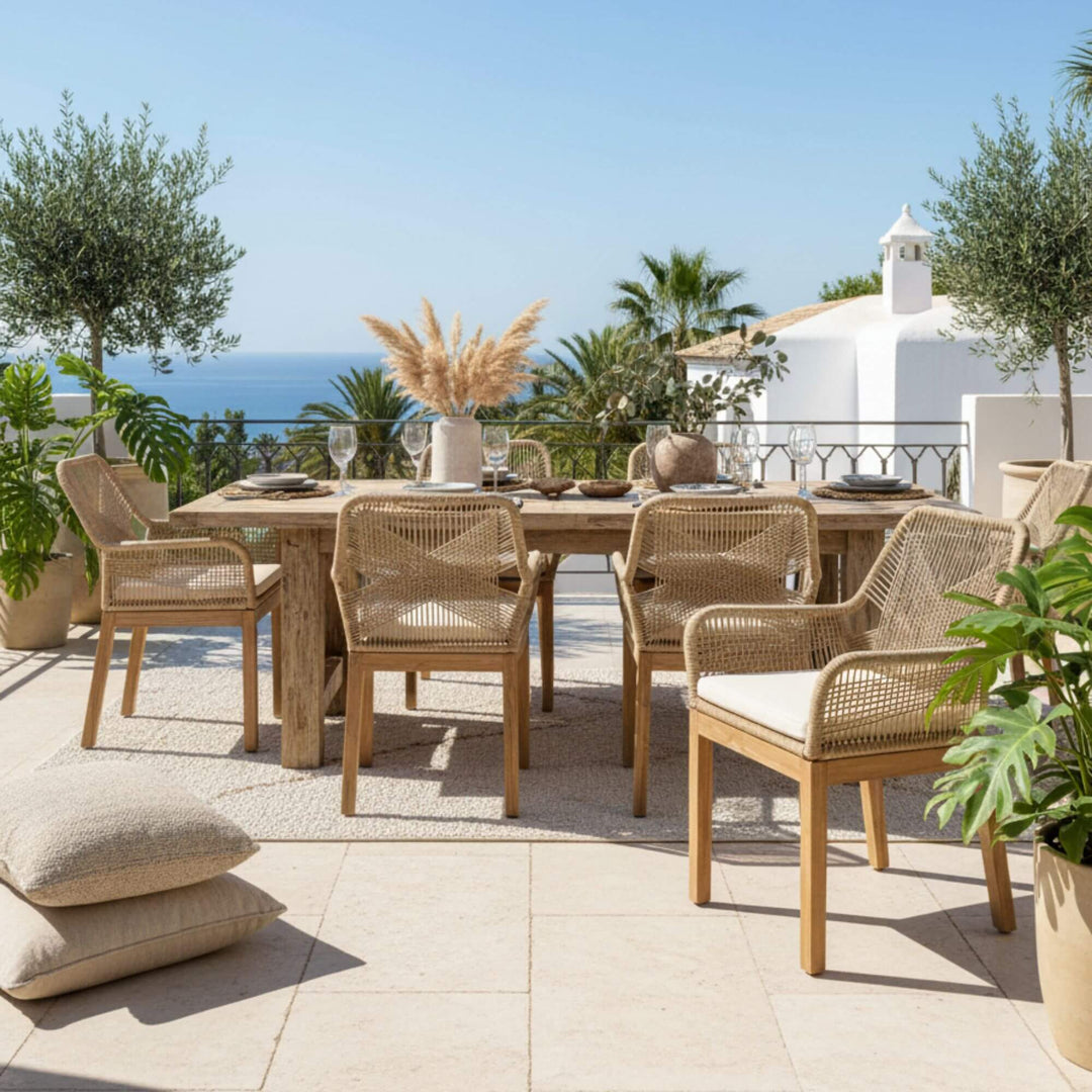 Outdoor dining set with table and Biyadhoo dining chairs on a patio with ocean view