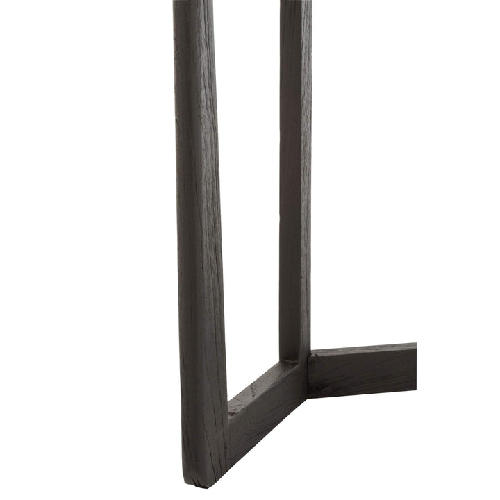 Leg detail of modern black acacia console.