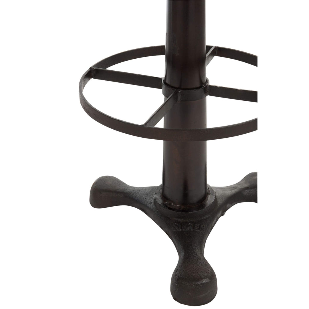 Detail of iron footrest and pedestal base of Buffalo Bar Stool.