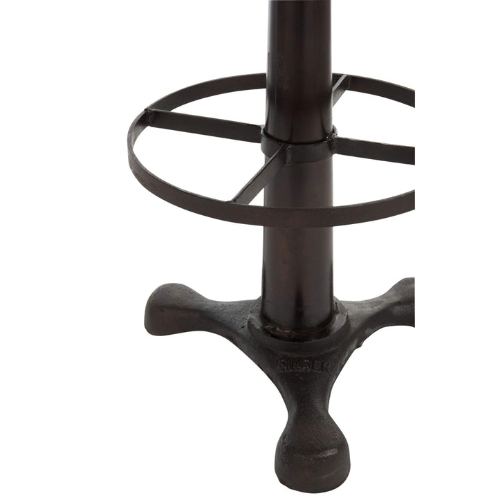 Detail of iron footrest and pedestal base of Buffalo Bar Stool.