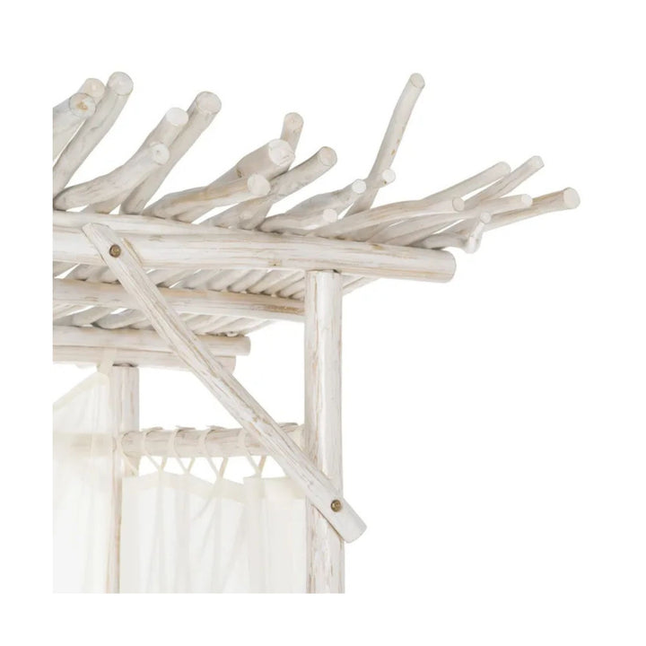 Roof structure detail with layered teak branches on Balinese daybed