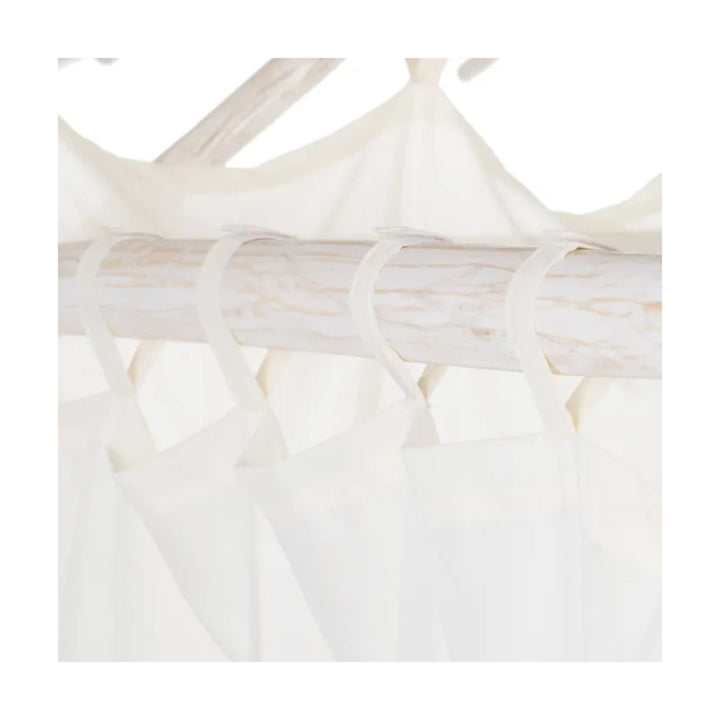 Close-up of natural teak grain on daybed frame