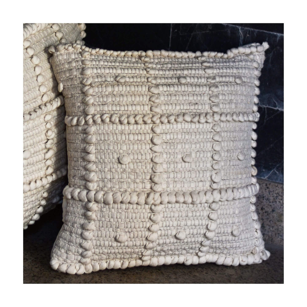 Calcuta cushion with matching calcuta puff. 