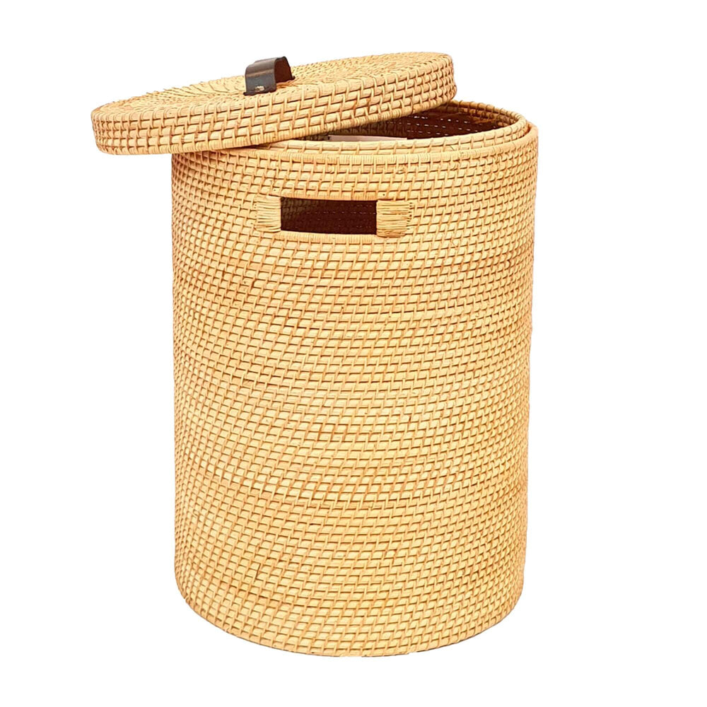 Side view of natural rattan laundry basket with lid partially open