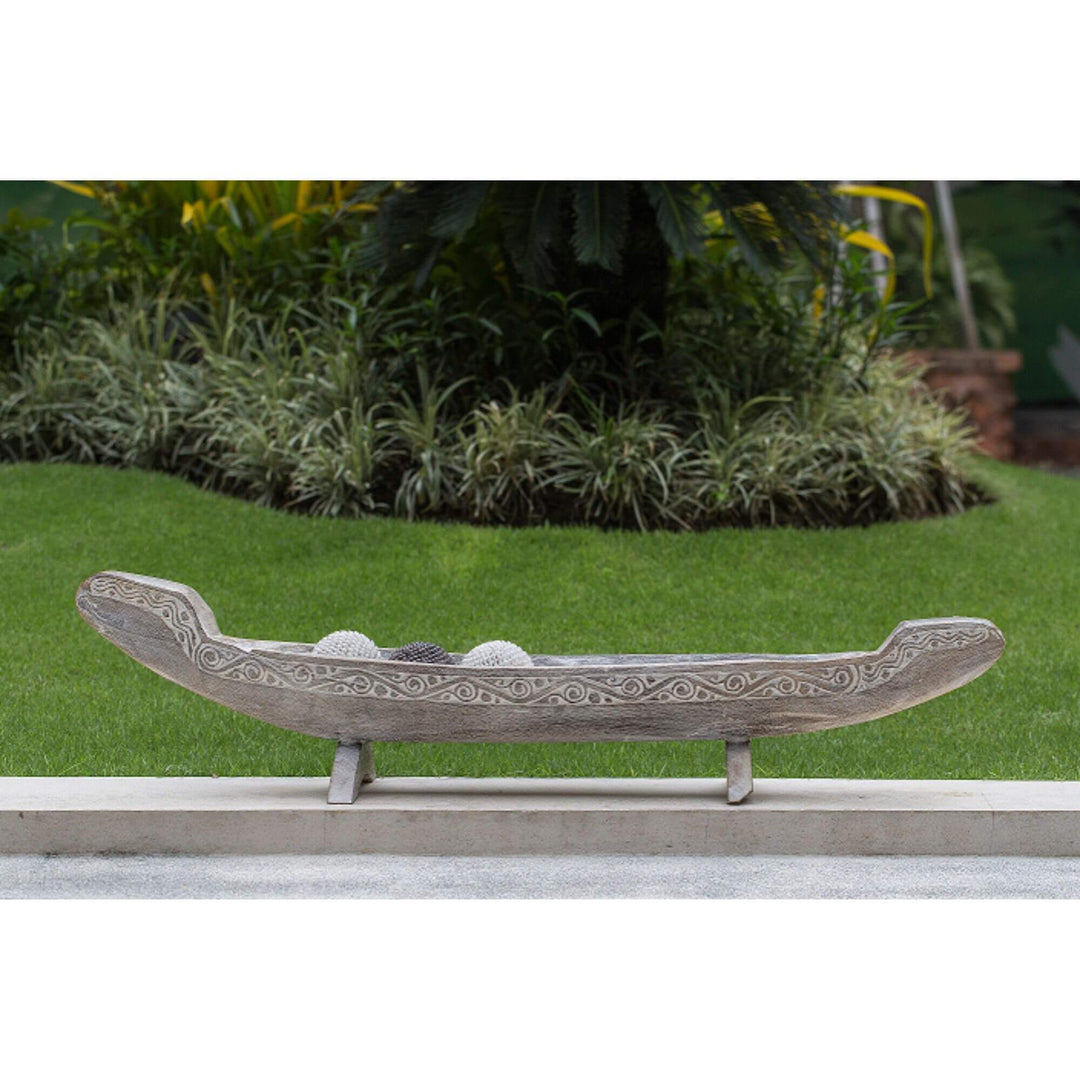 Calypso teak boat decor blackwashed finish displayed outdoors as decorative centerpiece