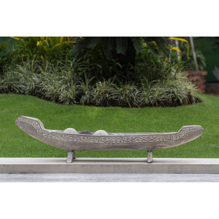 Calypso teak boat decor blackwashed finish displayed outdoors as decorative centerpiece