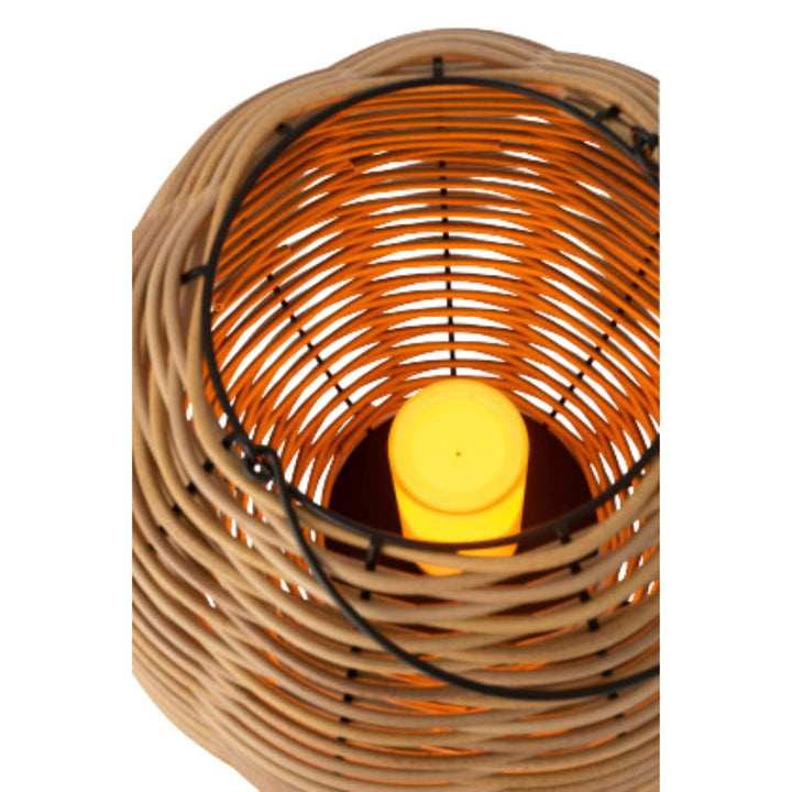 Interior view of cane lantern revealing warm LED candle glow