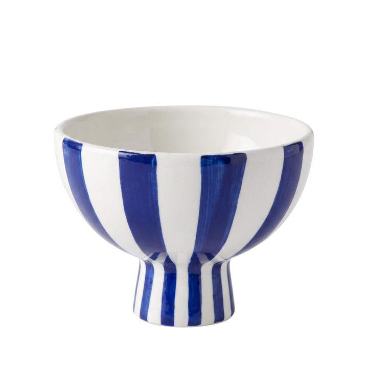 Front view of the Capri pedestal bowl showing its blue and white striped ceramic design and raised base.