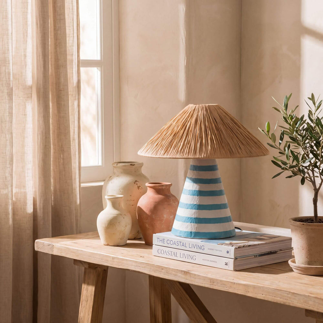 Styled console setting featuring the Capri table lamp in a warm Mediterranean-inspired interior.