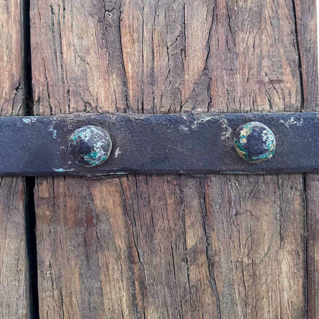 Detail of the Castle Door showing traditional metal reinforcement straps and decorative studded hardware