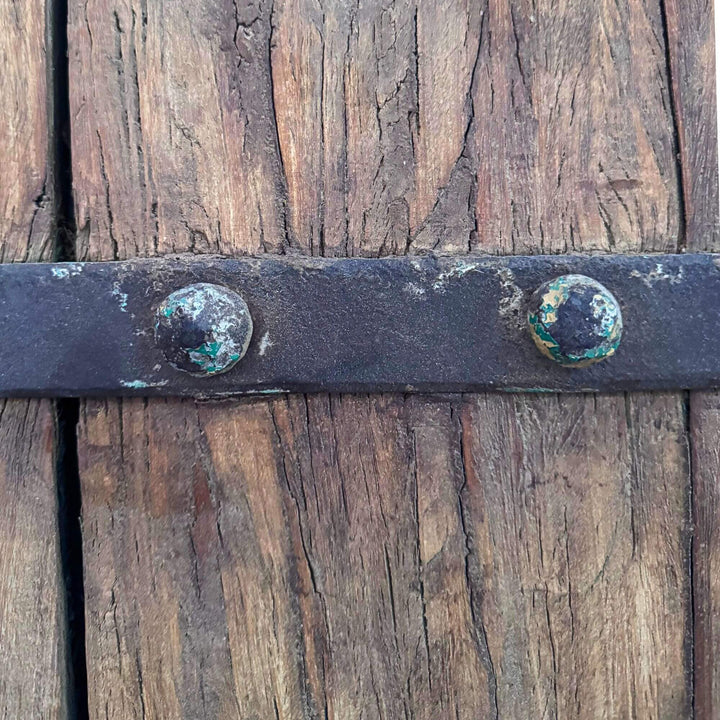 Detail of the Castle Door showing traditional metal reinforcement straps and decorative studded hardware