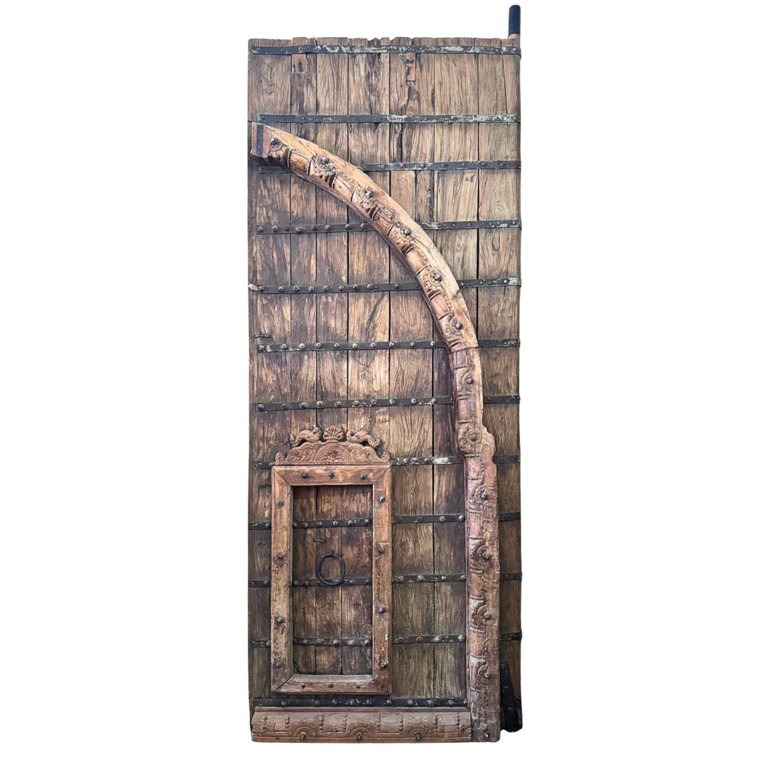 Front view of the right section of the Castle Door highlighting its carved arch and integrated smaller door