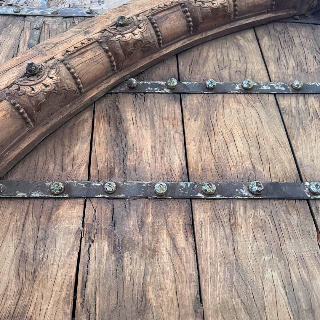 Close-up of the Castle Door highlighting the carved wooden arch and horizontal metal reinforcement straps