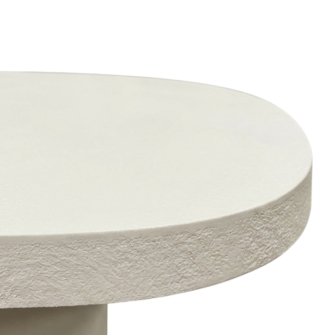 Close-up detail of the microcement finish showing subtle texture and natural surface variations.