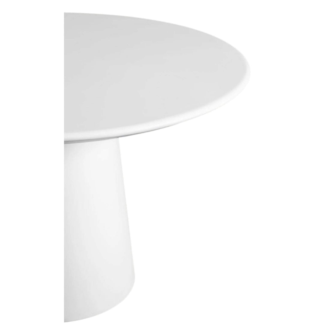 Side view of the rounded edge of the cement tabletop.