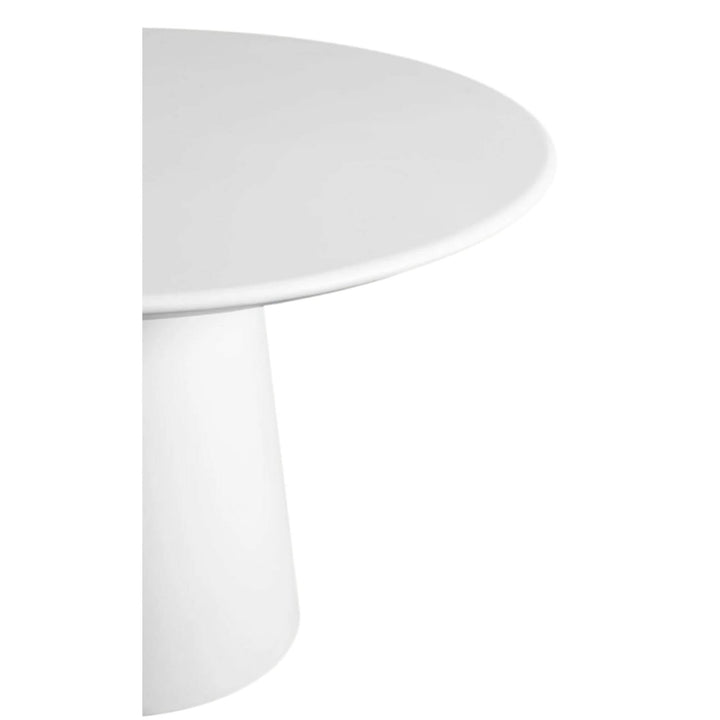 Side view of the rounded edge of the cement tabletop.