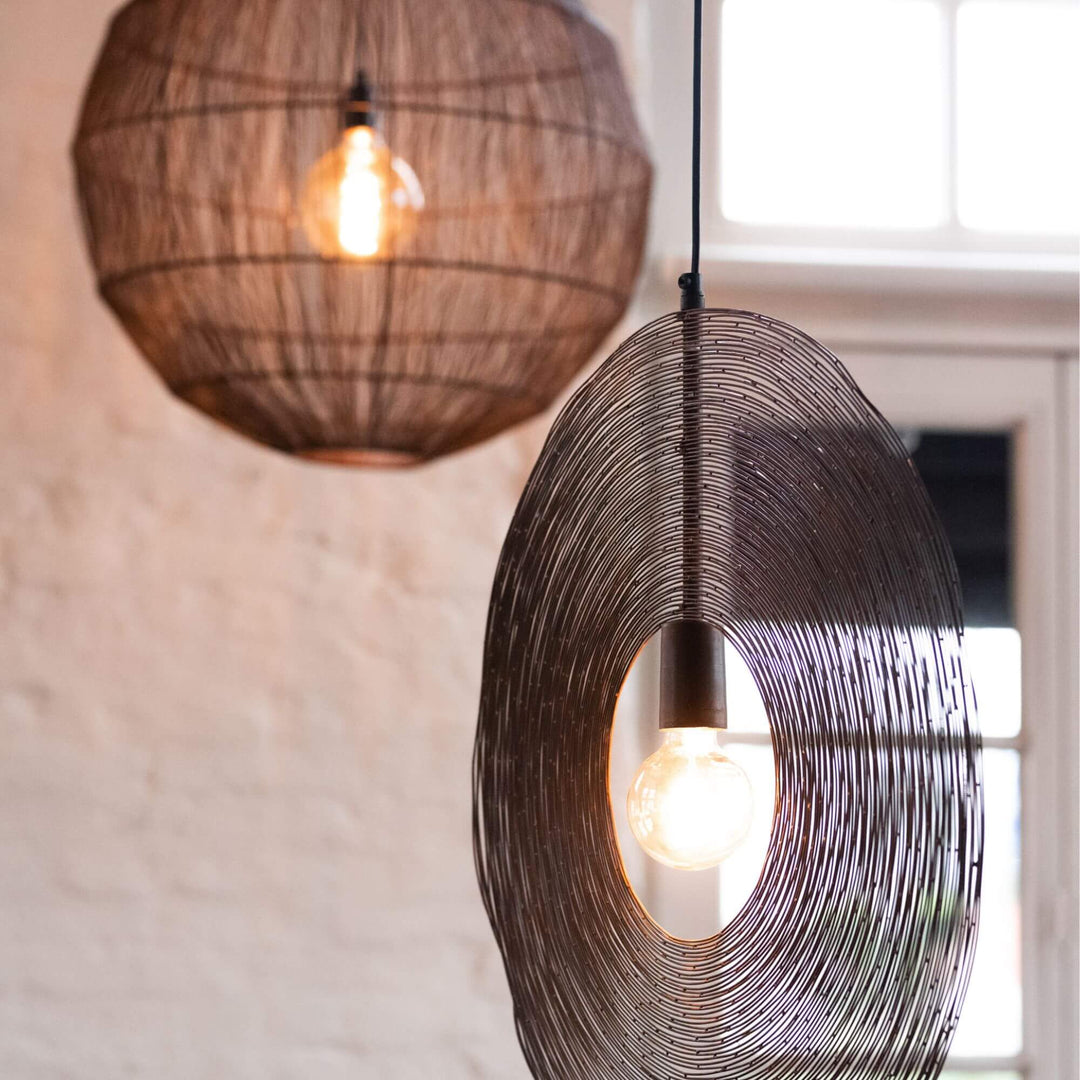 Close-up of metal round ceiling lamp hanging in interior decor