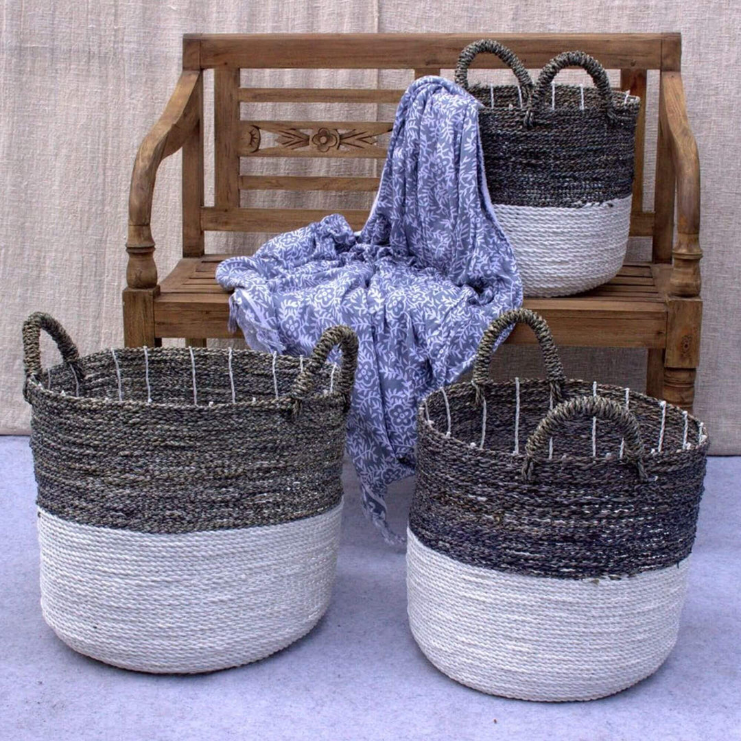Lifestyle image of Charcoal Baskets beside a wooden bench with throw blanket