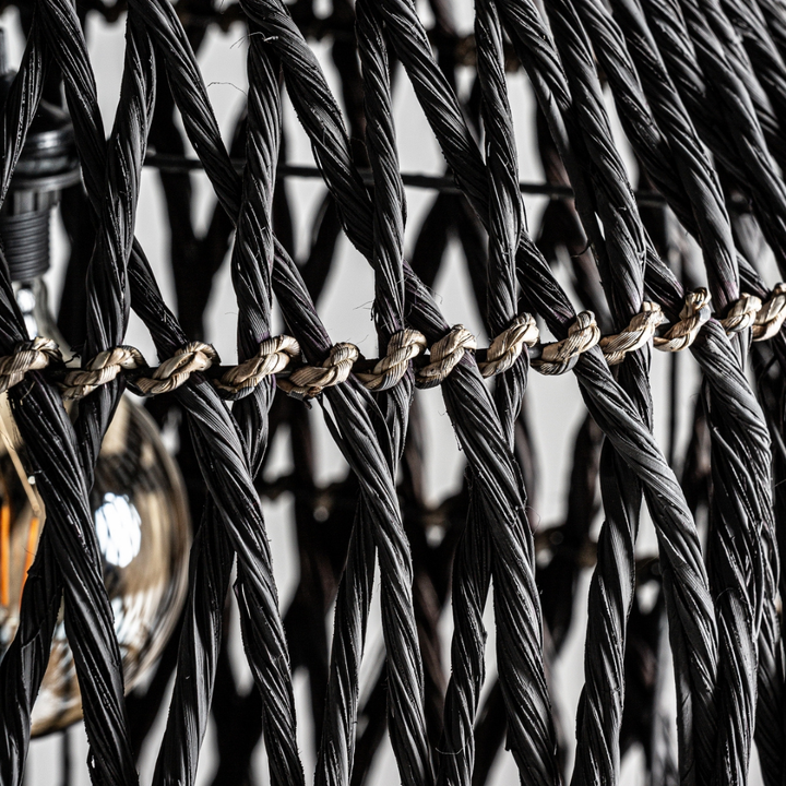 Close-up of handwoven black natural fibers on Charon lamp design.
