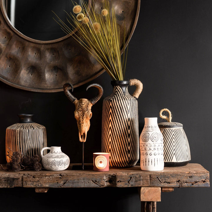 Rustic entryway setup featuring Chiang console table with decorative vases