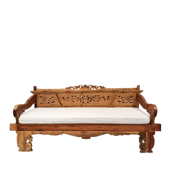 Chloe indonesian carved teak wood daybedwith white cushion on a white background