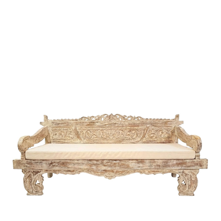 Chloe indonesian carved teak wood daybed with cream cushion on a white background