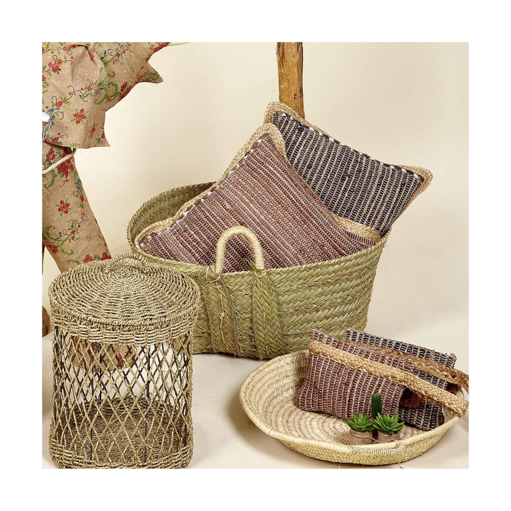 Chocolate Yute cushions styled in a natural basket with complementary decor