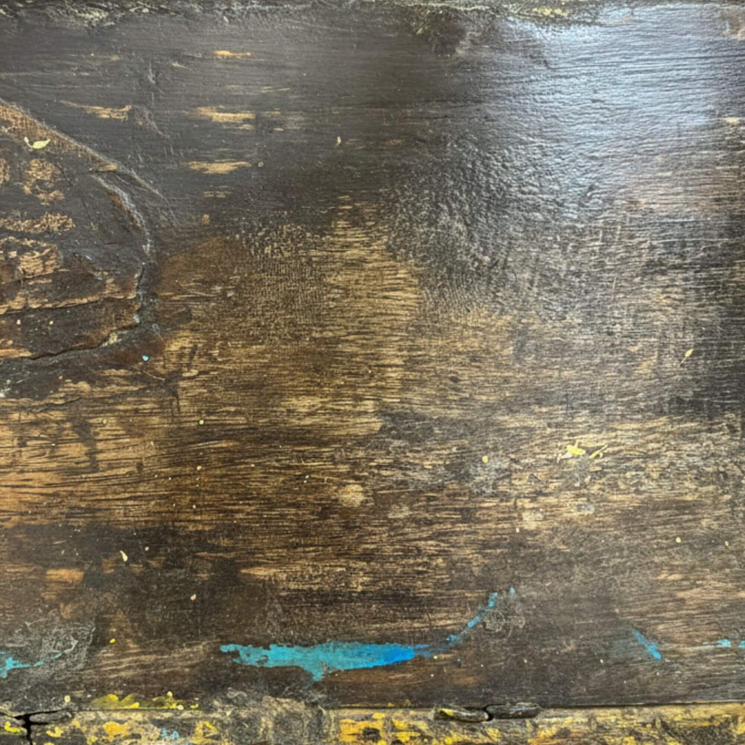 Close-up of the distressed wooden surface showing aged patina texture.