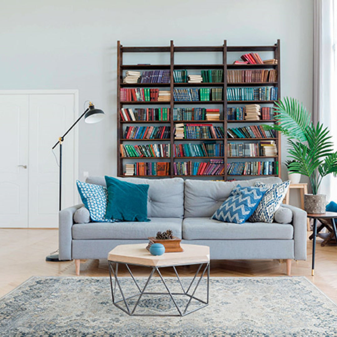Blue-toned Classico rug displayed with intricate border and center medallion.