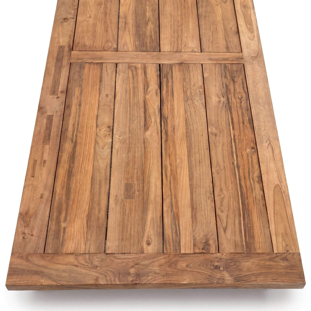 Top view of the tabletop showing the plank design and natural teak wood grain.