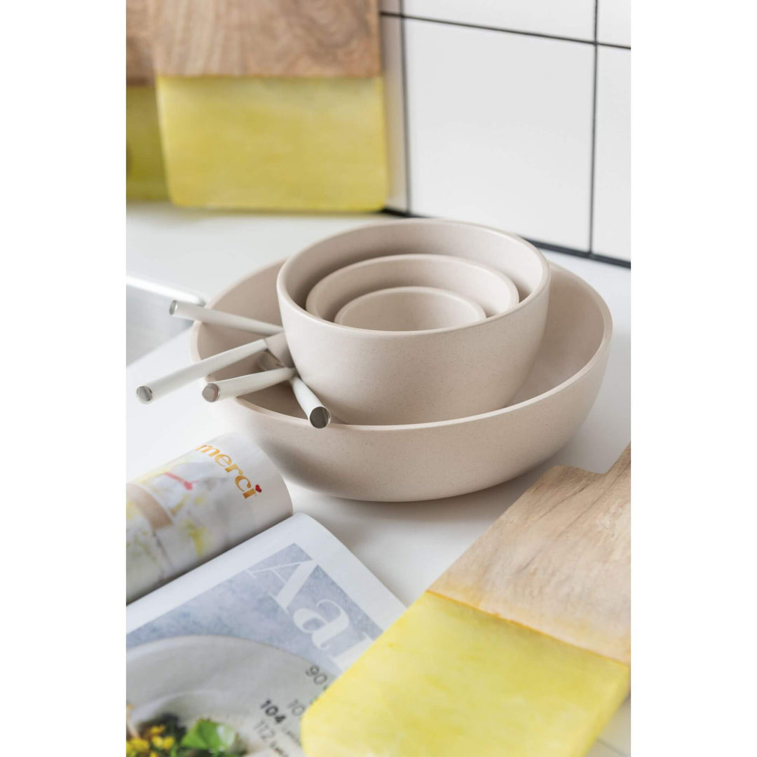 Claudia bowls stacked in multiple sizes on a modern dining table
