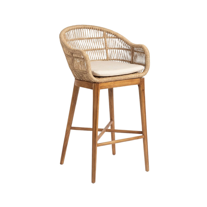 Angled view of Coco bar stool with a cushion on a white background