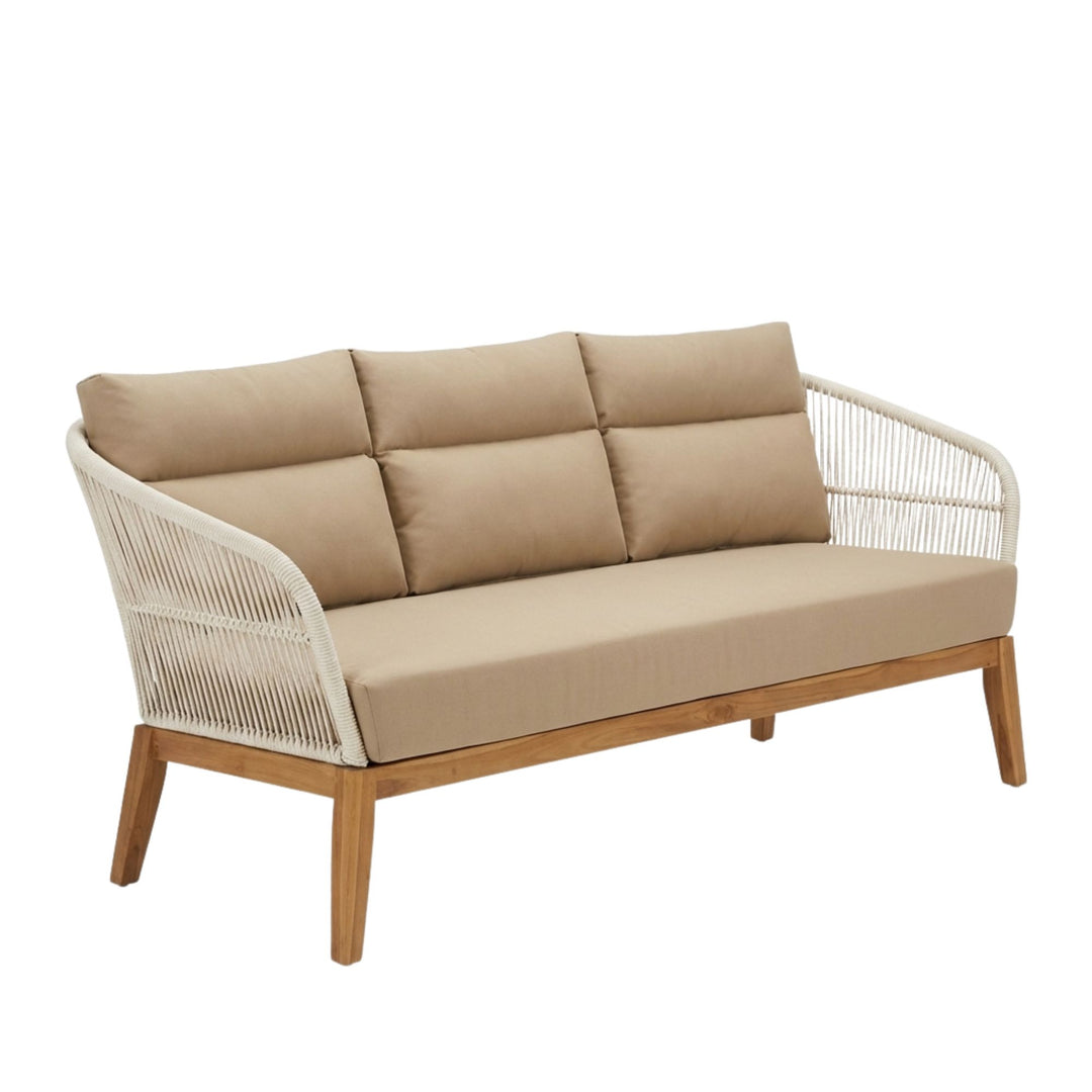 Styled outdoor scene featuring the Coco three seater sofa on a terrace with wooden coffee table and coastal decor.