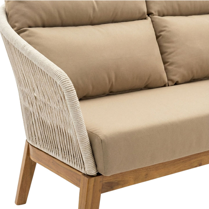 Close-up of the Coco sofa armrest showing woven rope detailing and cushioned seating.