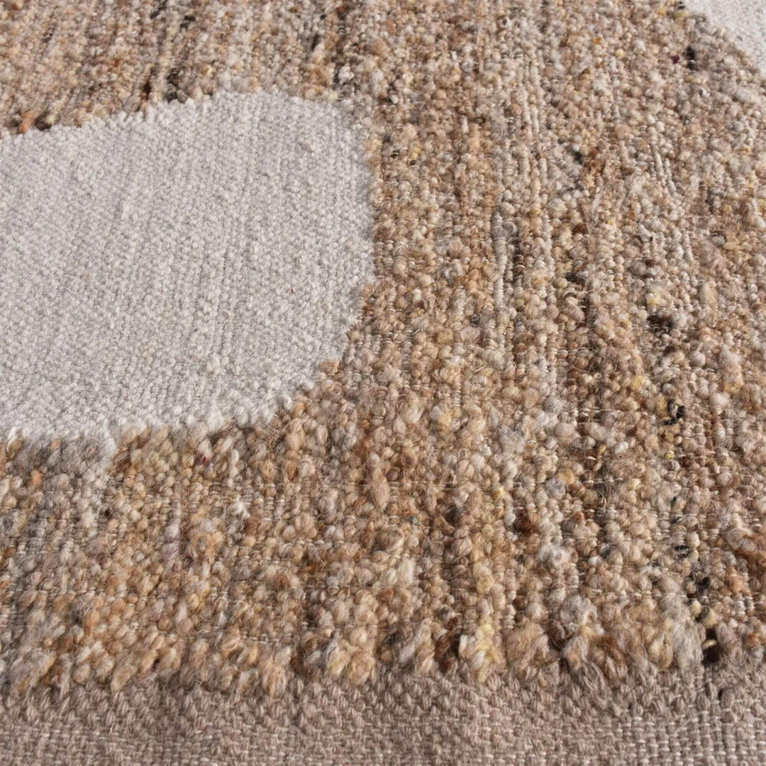 Close-up of the Colsea Rug highlighting woven wool texture and color variations.
