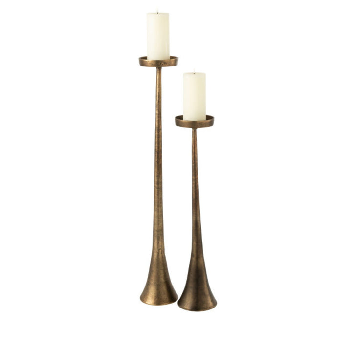 Group view of Copper Candle Stands in two heights showcasing their slender metal silhouettes and antique finish.