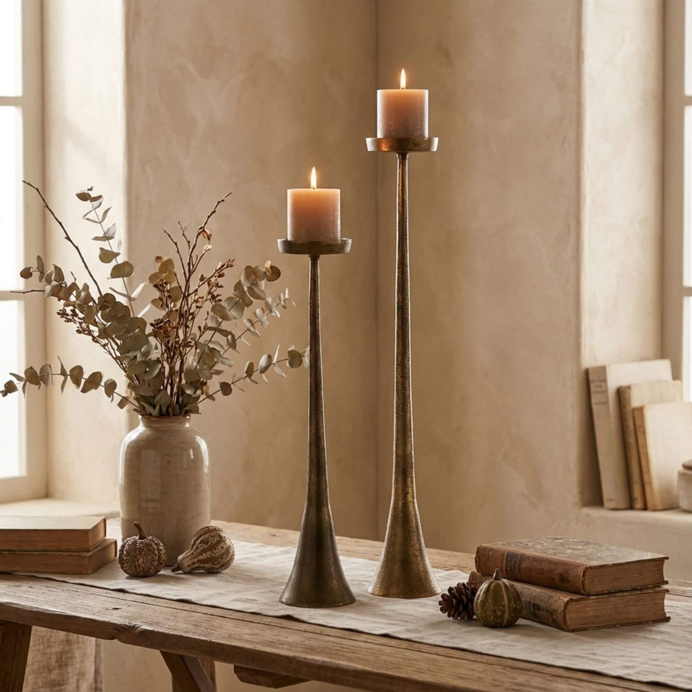 Styled interior view of Copper Candle Stands placed on a console table with lit candles creating a warm ambiance.